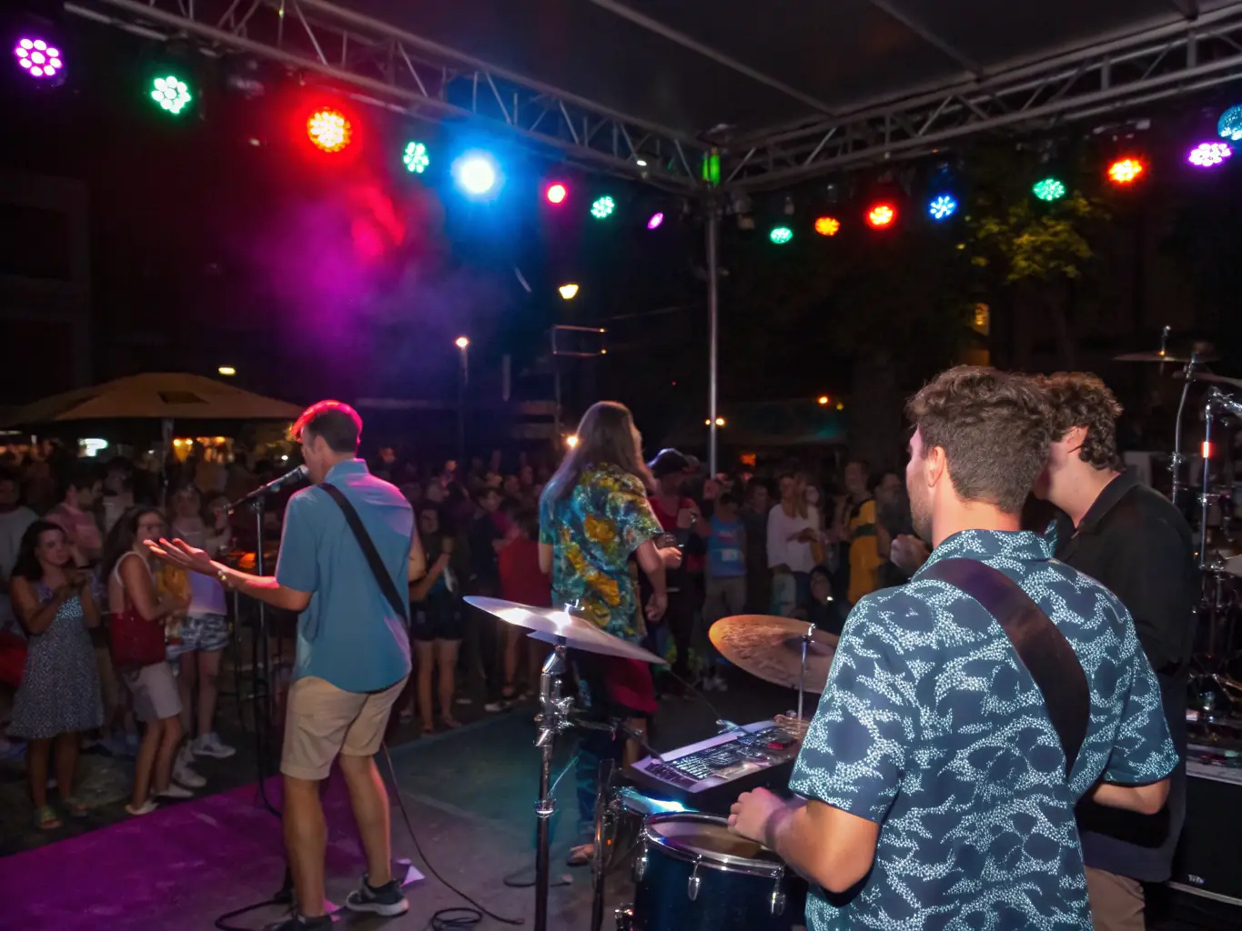 A vibrant photograph capturing a live music concert organized by LE BEC, showcasing diverse musicians and an enthusiastic audience.